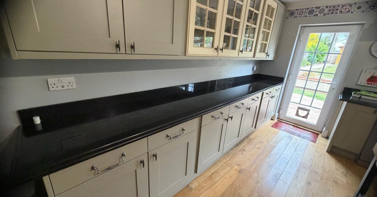 New Riva painted doors part-fitted in Yateley, Hampshire alongside the original cream glass cabinets