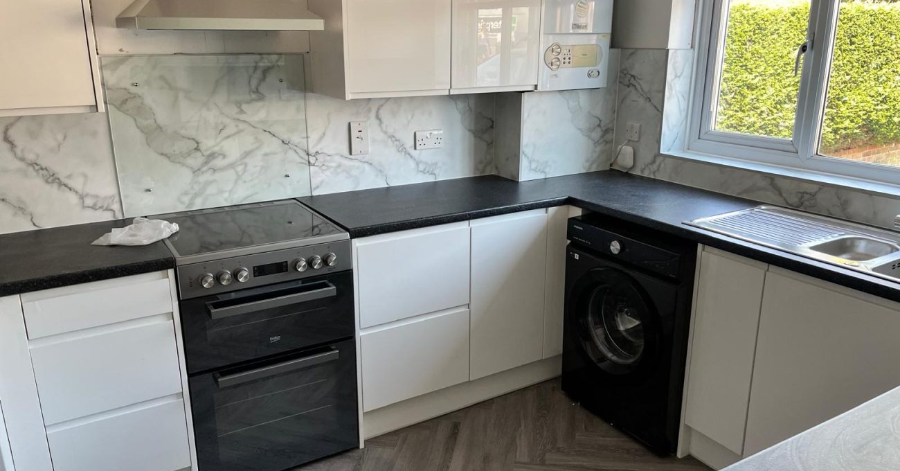 New Linear gloss painted kitchen nearing completion in Farnborough, Hampshire with herringbone LVT flooring