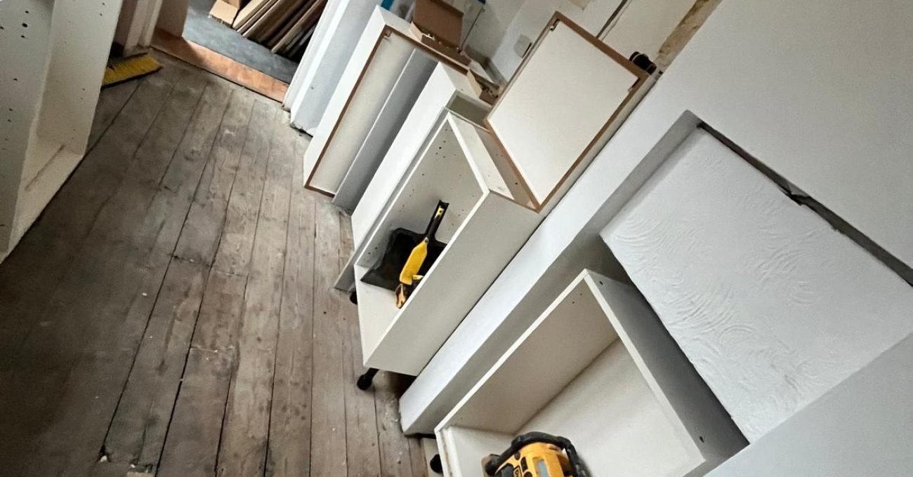 Water damaged kitchen in Guildford, Surrey stripped back to bare floorboards before the new kitchen was fitted