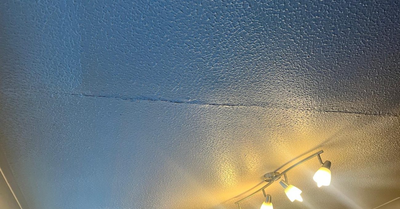 Ceiling and wall junction in Sandhurst, Berkshire recorded before the dividing wall was removed