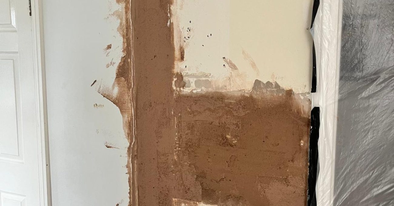 Boarded-up doorway replastered in Sandhurst, Berkshire as part of the open plan kitchen diner conversion